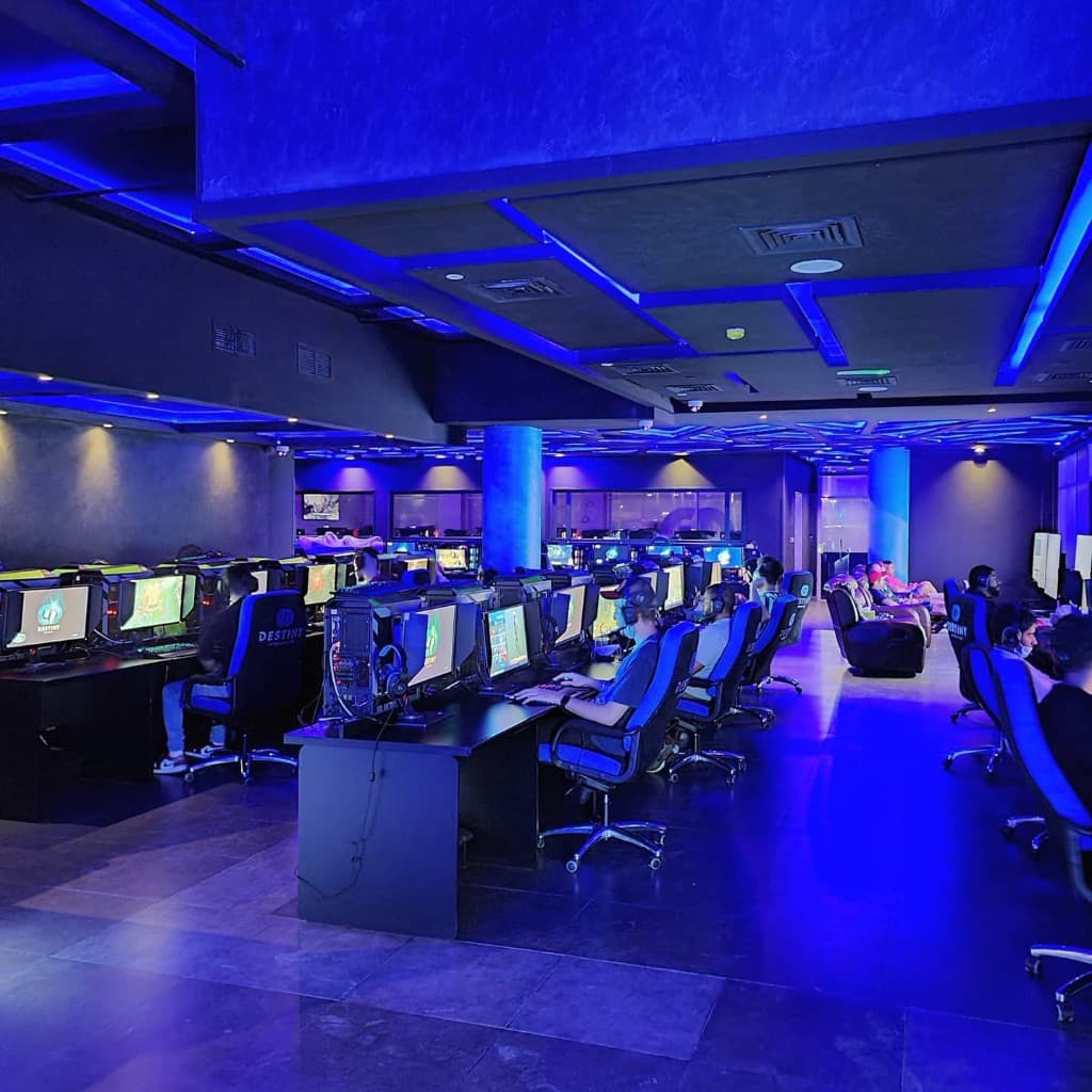Destiny Internet Cafe - professional gaming setup with blue ambient lighting